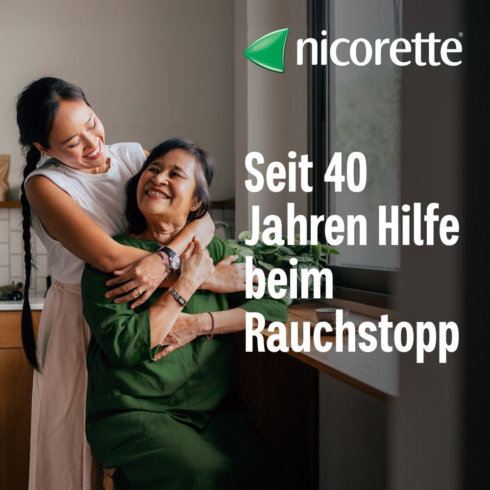 Zwei Frauen umarmen sich. Text: "Seit 40 Jahren Hilfe beim Rauchstopp". "nicorette" Logo.