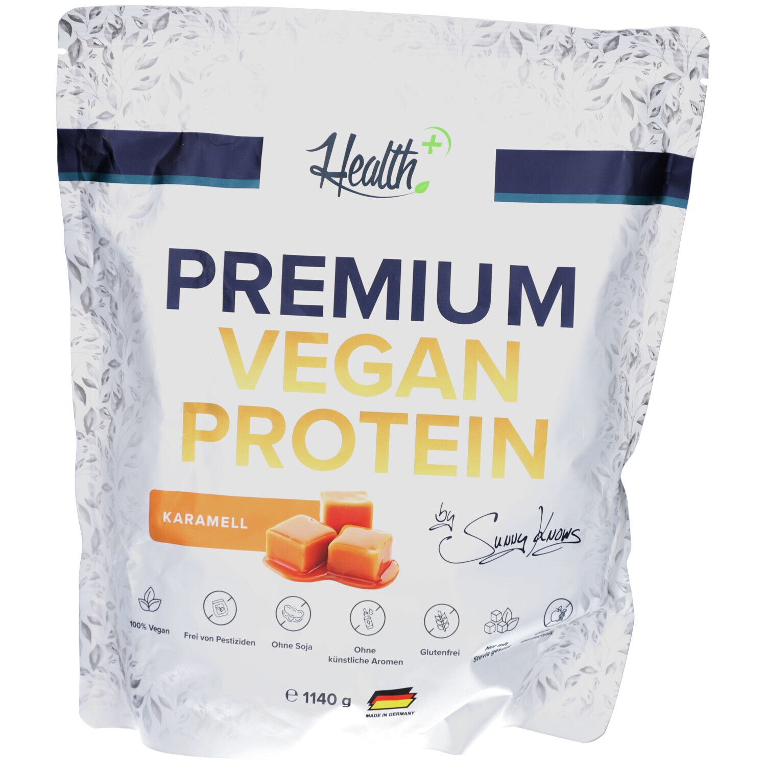 Beutel mit "Health+" Premium Vegan Protein. Aufschrift "Karamell". Abbildung von Karamellwürfeln. Siegel: "100% Vegan".