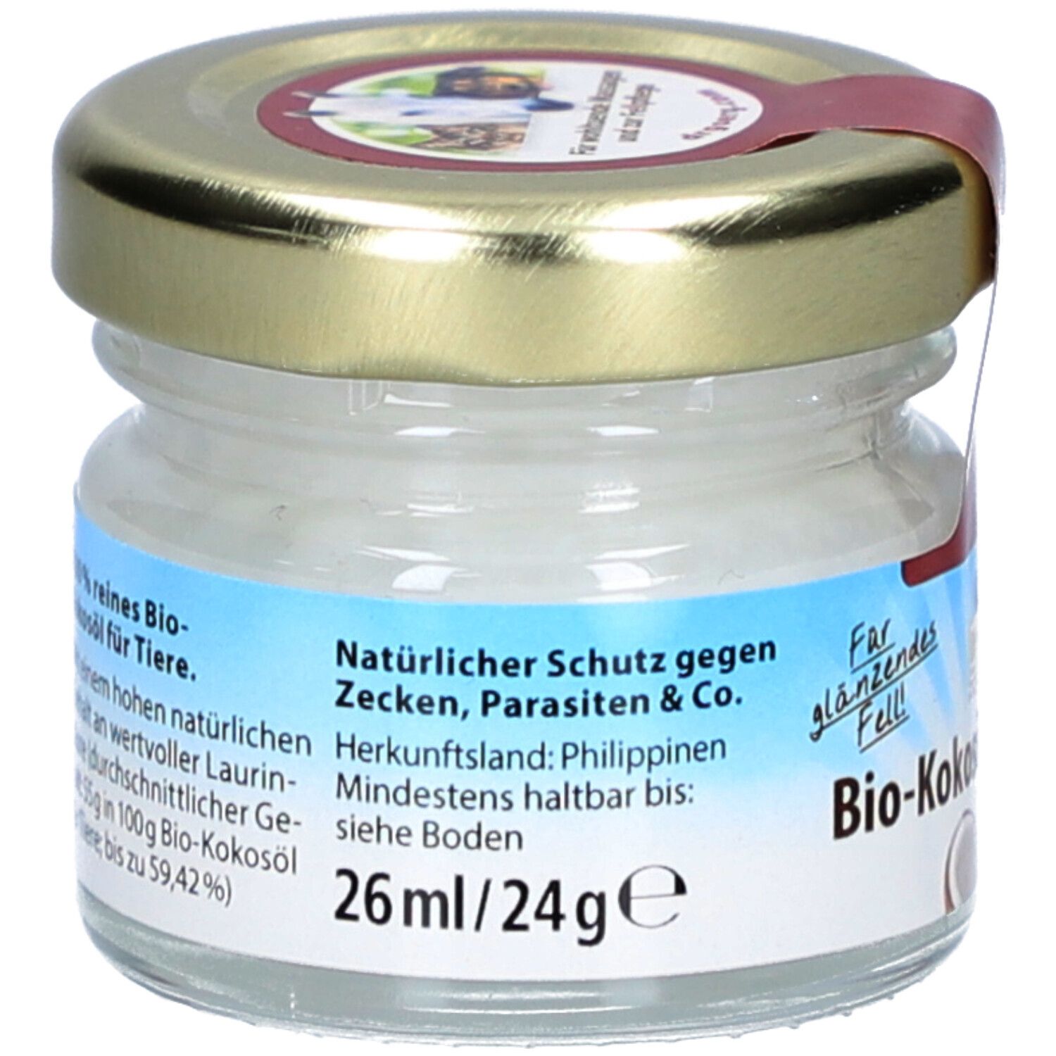 Glas mit Bio-Kokosöl für Tiere. Etikett mit Text: Natürlicher Schutz gegen Zecken, Parasiten & Co. 26ml/24g. Herkunftsland: Philippinen.
