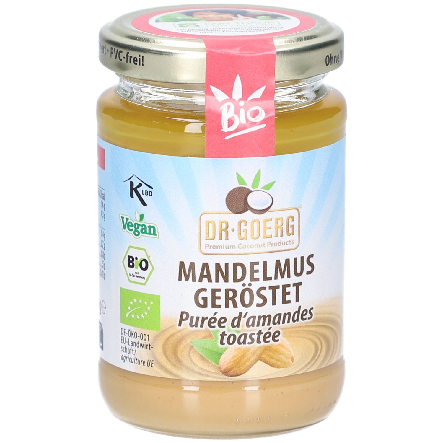 Glas mit Mandelmus, geröstet. Etikett mit Bio-Siegel, Vegan-Logo und Produktname. Deckel mit Aufschrift.
