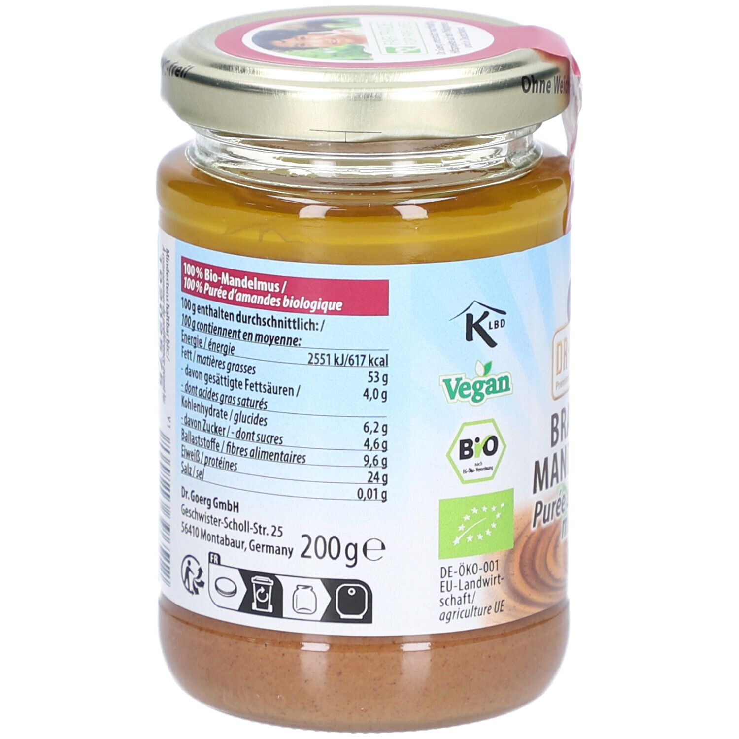 Glas mit braunem Mandelmus. Rückseite mit Nährwertangaben und "Vegan"-Logo. 200g-Angabe.