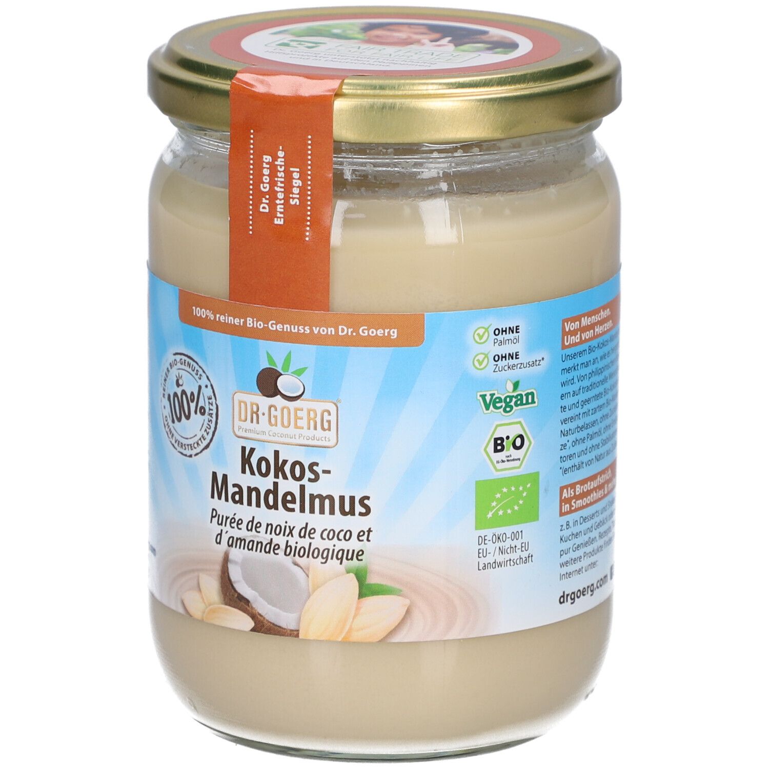 Glas mit Kokos-Mandelmus. Etikett mit Produktinformationen und Logo. Deckel goldfarben, Siegel. Bio-Zertifizierung, Vegan.