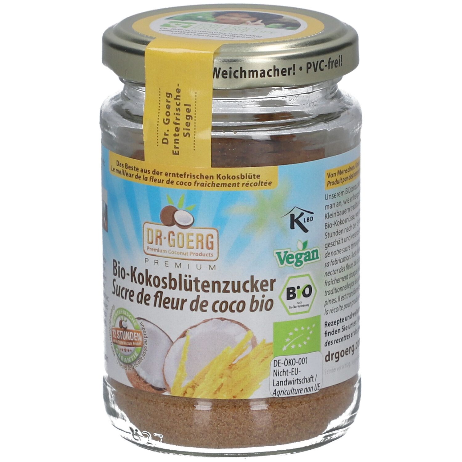 Glas mit Bio-Kokosblütenzucker. Gelbes Etikett mit Produktinformationen. Deckel mit Aufschrift.