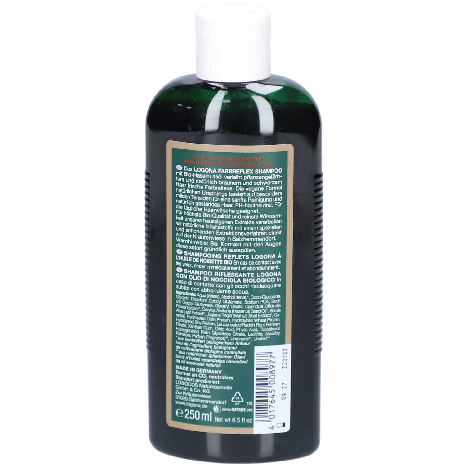 Rückseite der grünen Flasche. Text in Deutsch, Inhaltsstoffe, Herstellerinformationen. Volumen: 250 ml. Vegan-Siegel.