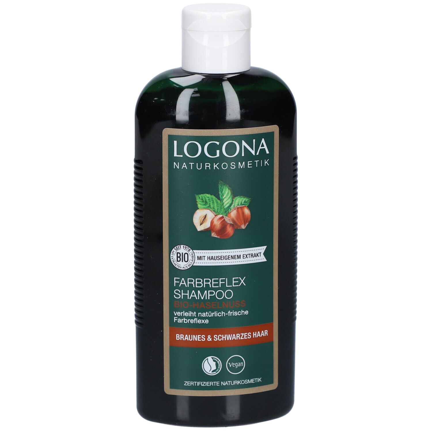 Grüne Flasche mit weißem Deckel. Aufschrift: LOGONA Naturkosmetik, Farbreflex Shampoo, Bio-Haselnuss. Vegan-Siegel.