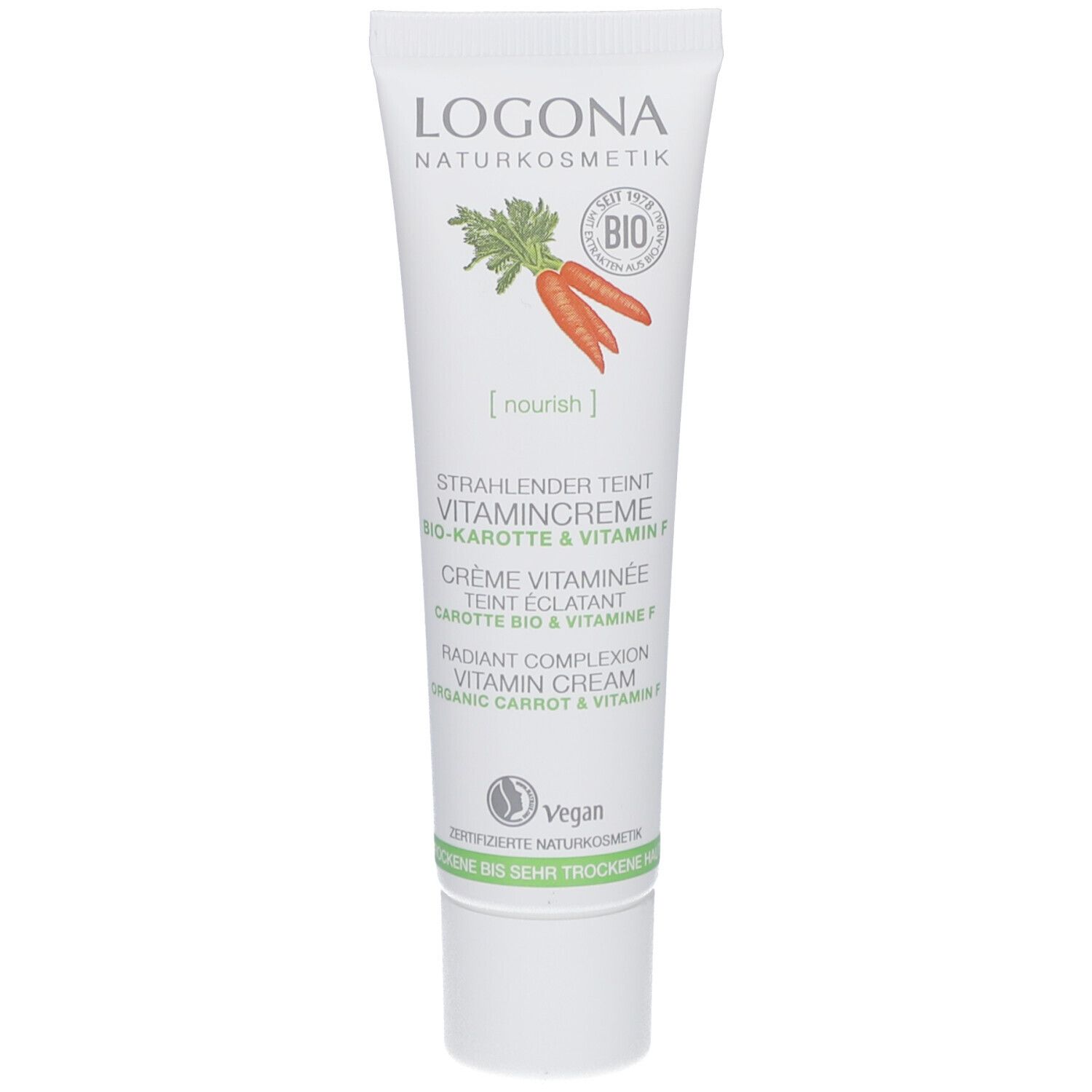 Creme-Tube mit Karotten- und Vitamin-F-Aufdruck. Logo und Produktbezeichnung sichtbar. Vegan-Siegel.