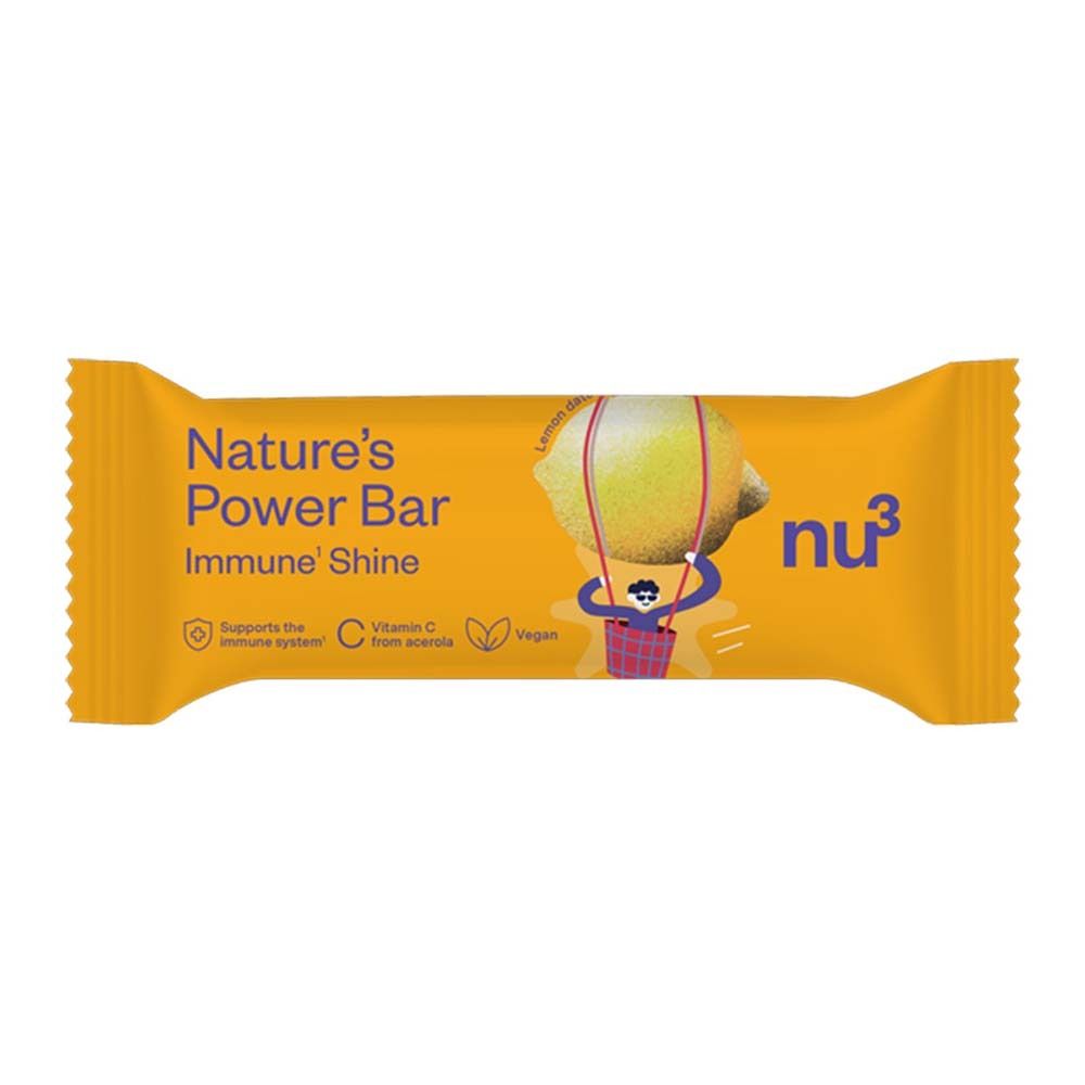 Gelber Riegel, verpackt. Aufschrift: Nature's Power Bar Immune' Shine, nu3 Logo, Zitrone-Illustration. Enthält Vitamin C. Vegan.
