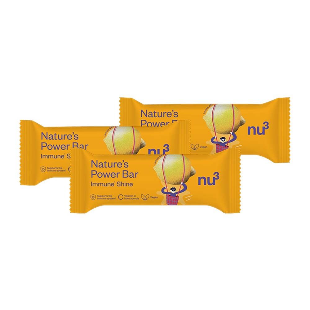 Vier gelbe Riegel. Aufschrift: Nature's Power Bar, Immune Shine, nu3. Abbildung einer Zitrone mit Gesicht.