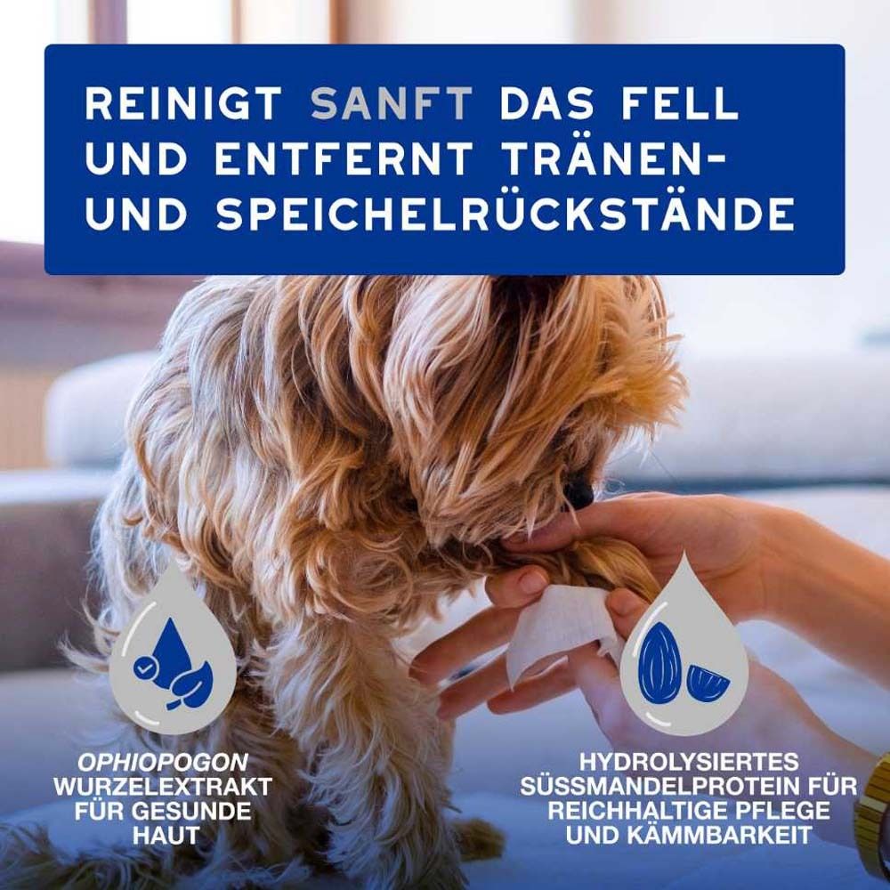 Hund wird mit Feuchttuch gereinigt. Text: Reinigt sanft das Fell und entfernt Tränen- und Speichelrückstände. Inhaltsstoffe.