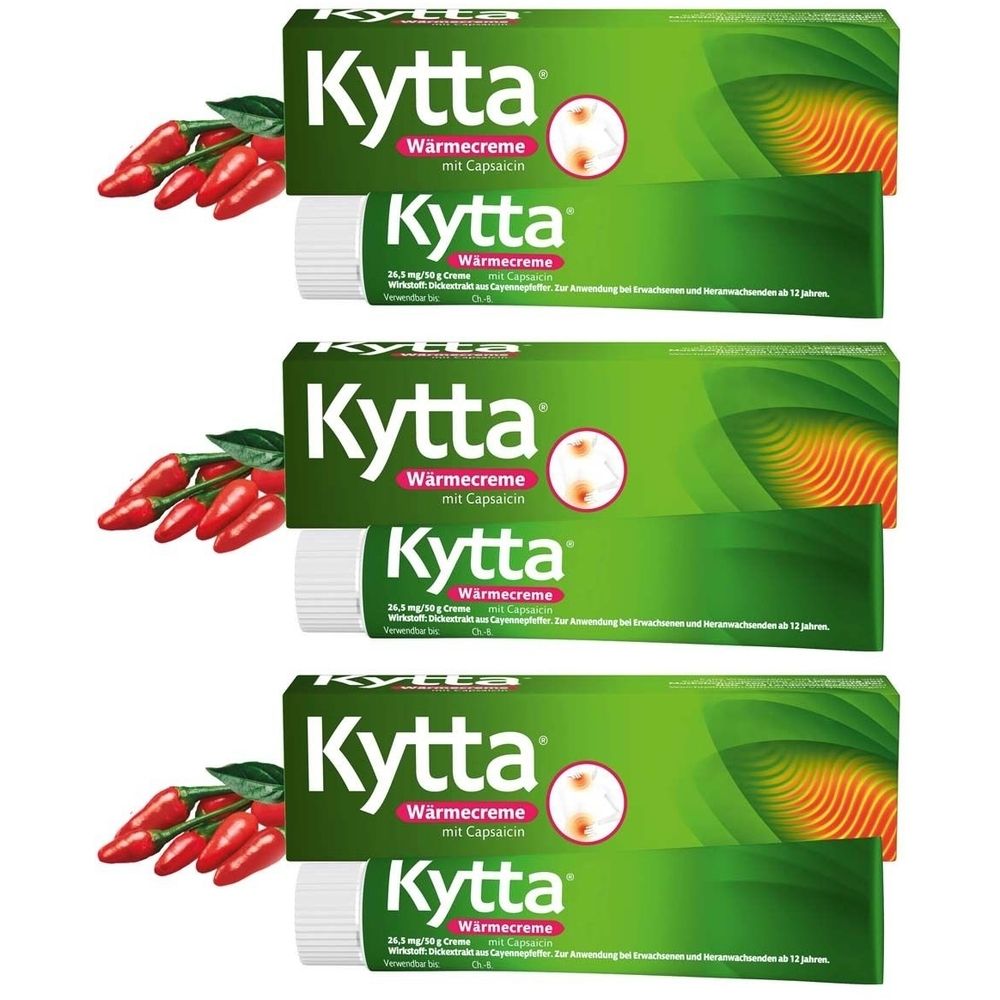 Kytta Wärmecreme mit Capsaicin, Tuben und Verpackungen. Rote Chilischoten liegen daneben.