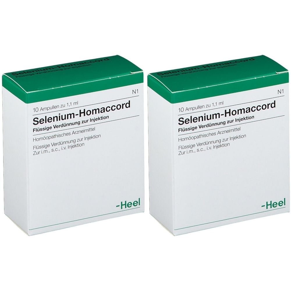 Zwei Schachteln mit "Selenium-Homaccord". Weiße Verpackung mit grünen Deckeln. Text: Flüssige Verdünnung zur Injektion, Heel.