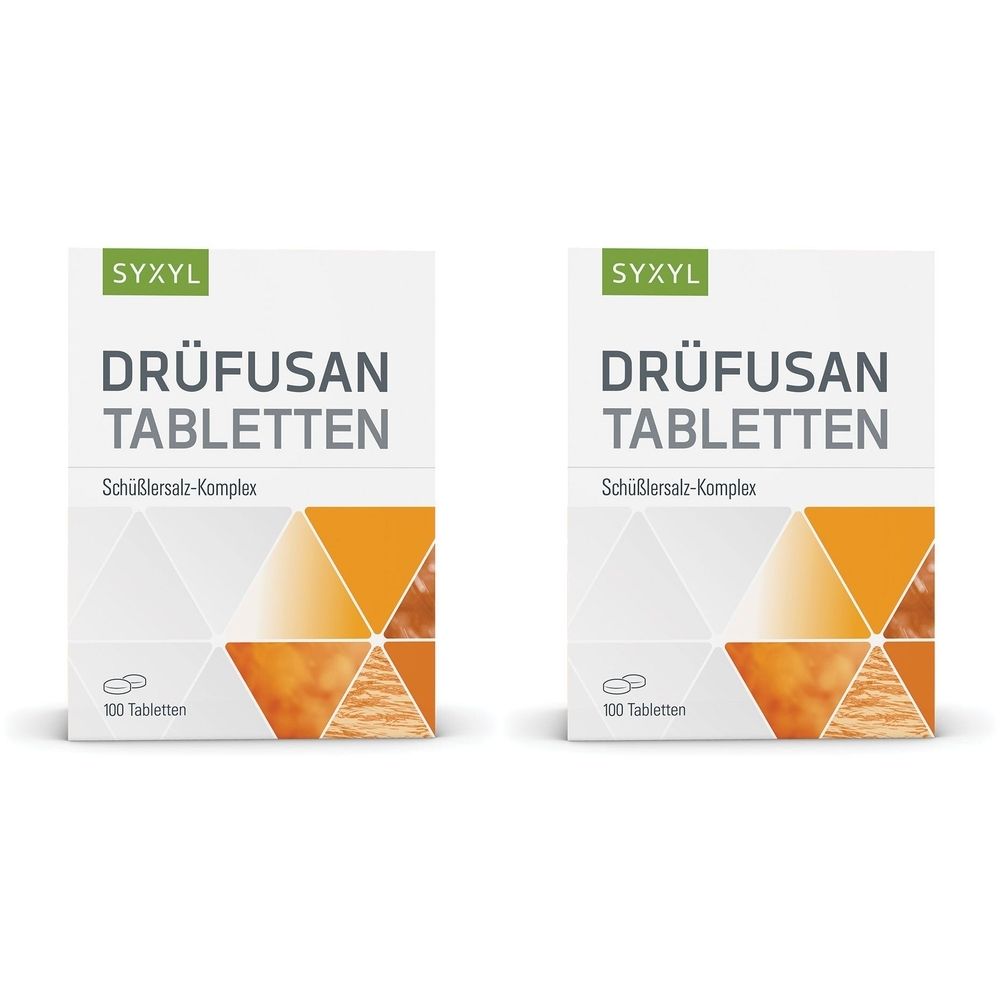 Zwei weiße Schachteln mit "DRÜFUSAN TABLETTEN" und "SYXYL"-Logo. Aufschrift "Schüßlersalz-Komplex" und "100 Tabletten".