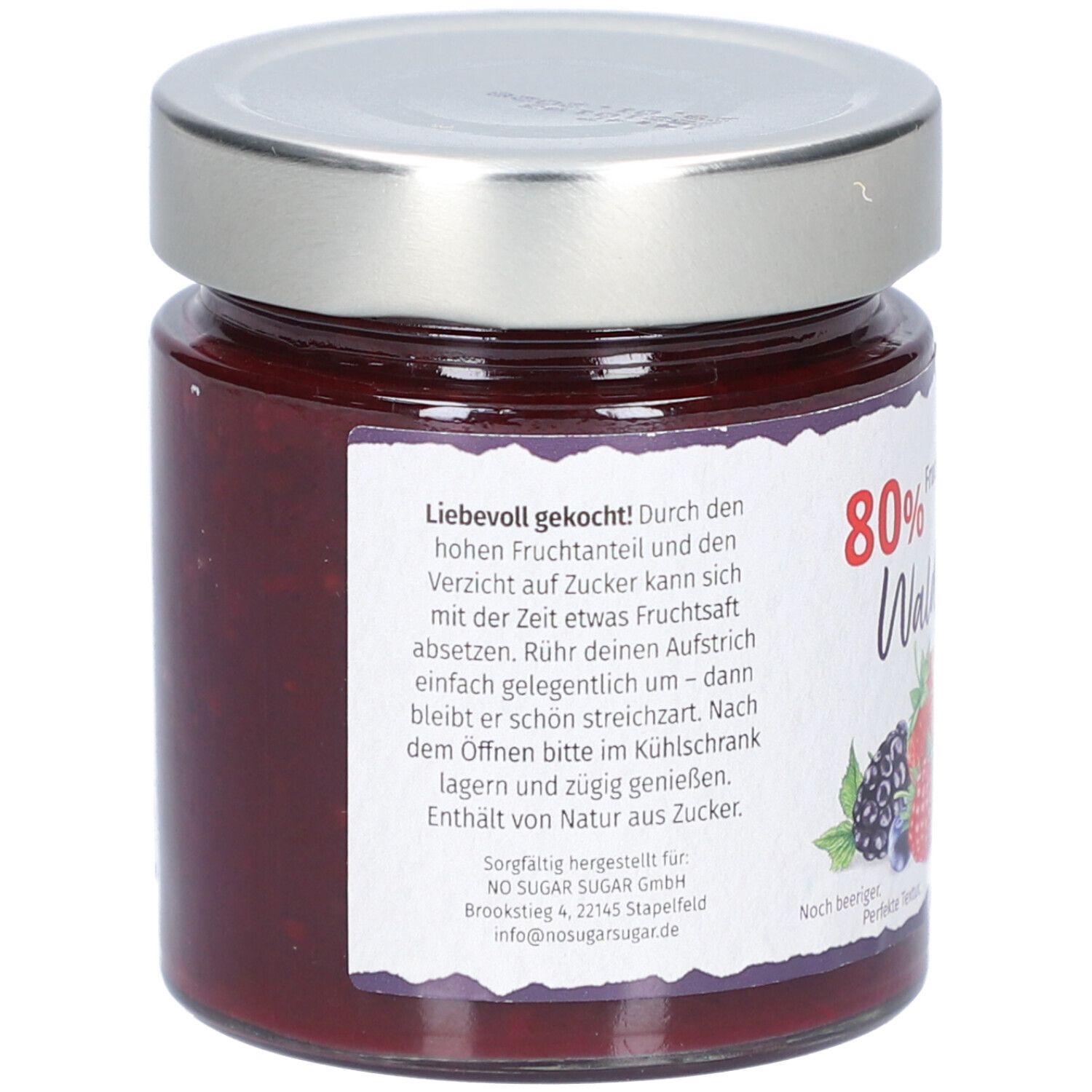 Glas mit Waldfrüchte-Aufstrich. Rückseite mit Text, 80% Frucht, ohne Zuckerzusatz, und Früchte-Illustration.