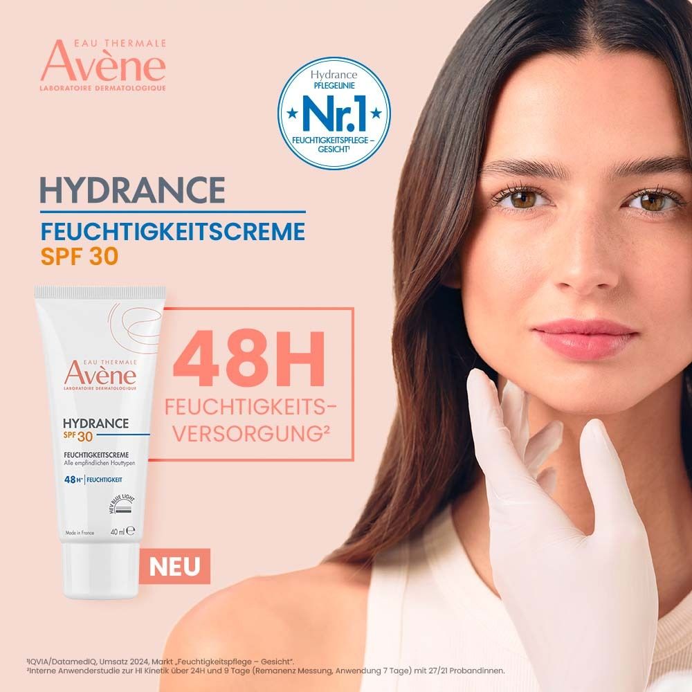 Frau mit weißem Handschuh hält Avène Hydrance Feuchtigkeitscreme SPF 30. Text: Hydrance Feuchtigkeitscreme SPF 30. 48H Feuchtigkeitsversorgung. Nr.1.