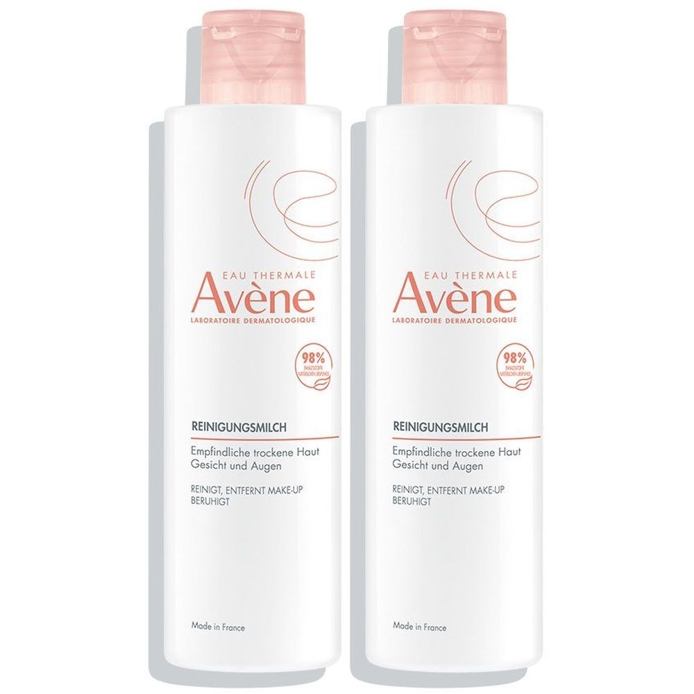 Zwei Flaschen Reinigungsmilch. Weiße Flaschen mit rosa Deckel. Aufschrift: Avène, Reinigungsmilch, für trockene Haut, Gesicht und Augen.