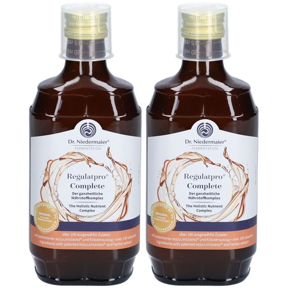 Zwei braune Flaschen mit weißem Etikett. Aufschrift: Regulatpro Complete. Mit goldfarbenem Verschluss und Siegel.