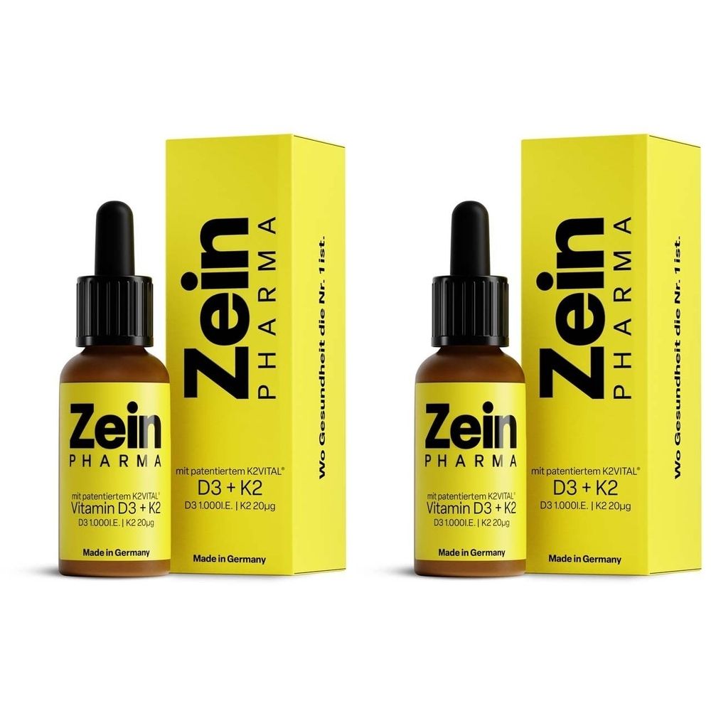 Zwei Flaschen mit brauner Flüssigkeit und schwarzer Pipette, neben gelben Schachteln. Aufschrift: Zein Pharma, Vitamin D3 + K2.