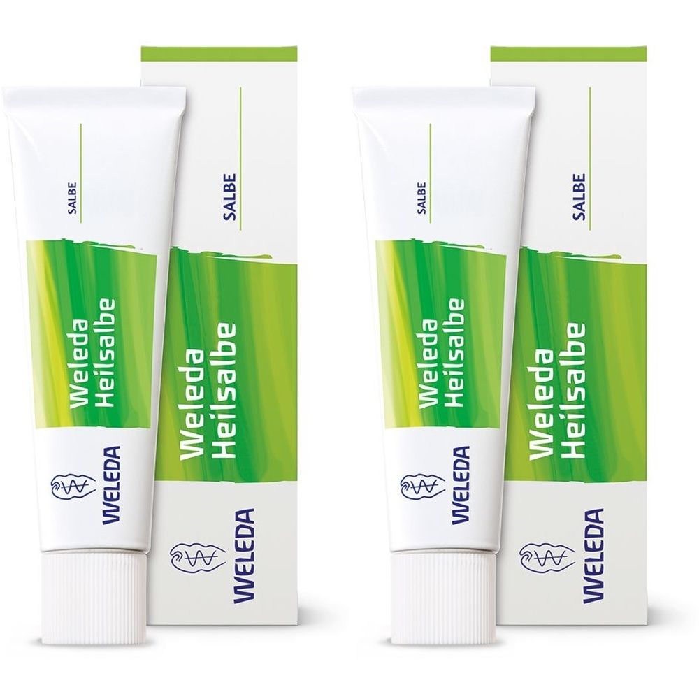 Zwei Tuben und Schachteln. Auf den Tuben steht "Weleda Heilsalbe". Die Schachteln sind weiß mit grünen Akzenten und dem Schriftzug "SALBE".