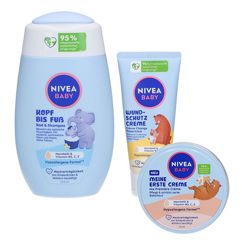 Drei Baby-Pflegeprodukte: Shampoo, Wundschutzcreme und Creme. Hellblaue Verpackungen mit Logos und Illustrationen. Hypoallergene Formel.