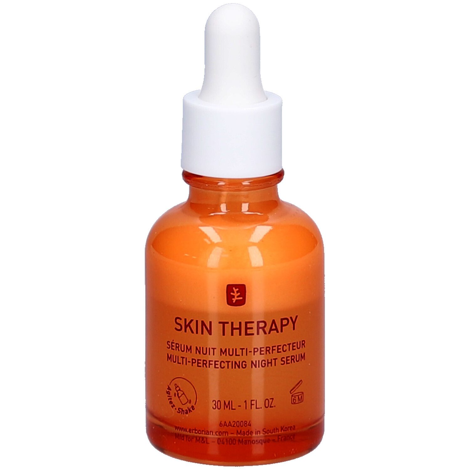 Orangefarbene Glasflasche mit weißem Deckel und Pipette. Aufschrift: Skin Therapy Serum Nuit Multi-Perfecteur.