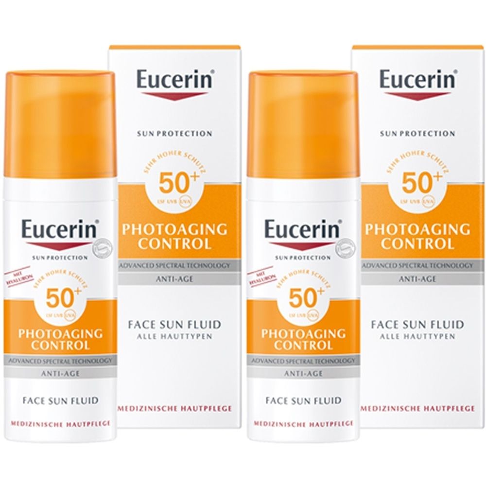 Drei Flaschen und drei Kartons Eucerin Photoaging Control Face Sun Fluid LSF 50. Weiße Verpackung mit orangefarbenen Akzenten.