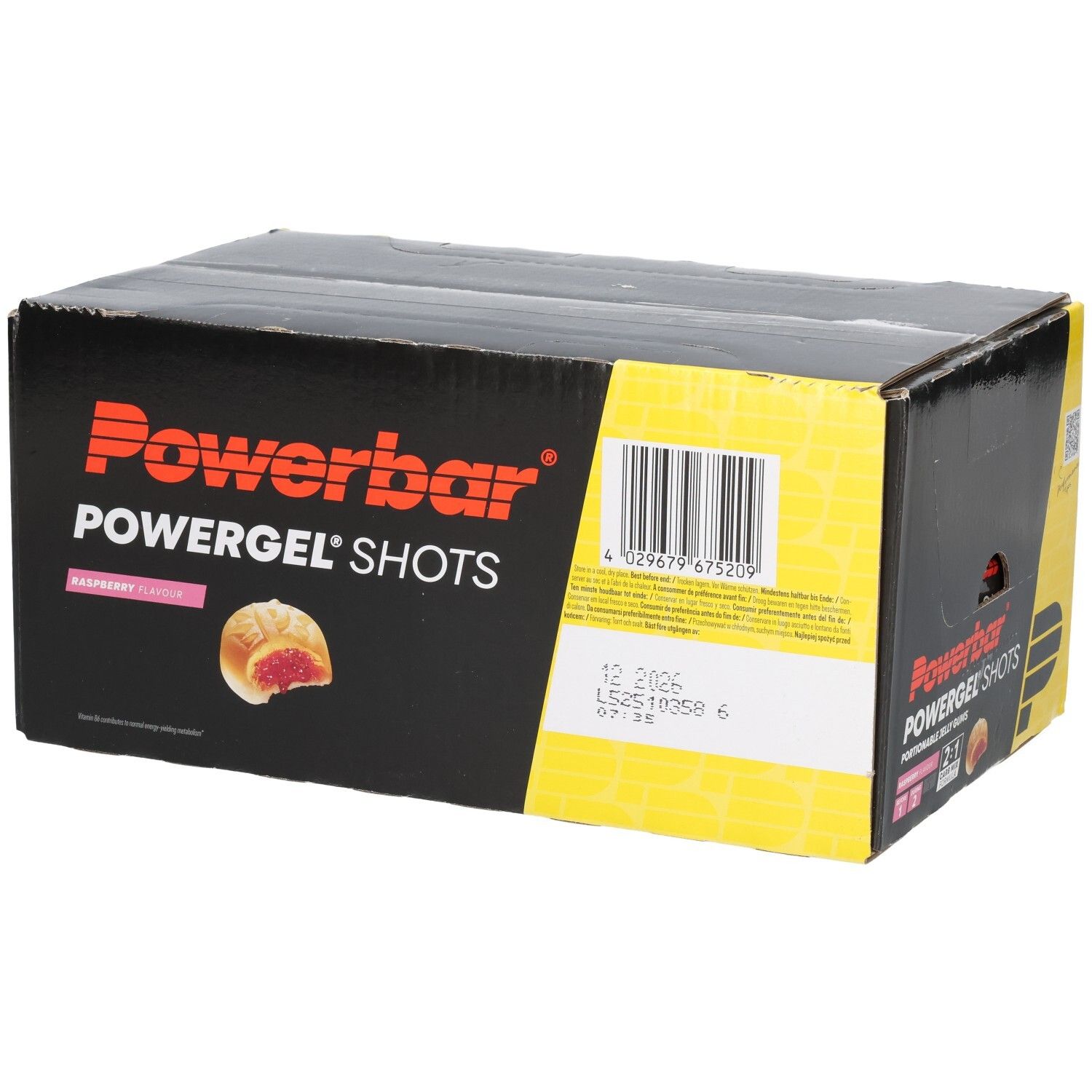 Schwarzer Karton mit Powerbar Powergel Shots. Aufdrucke: Himbeere, Barcode, Mindesthaltbarkeitsdatum. Gelbe und rote Akzente.