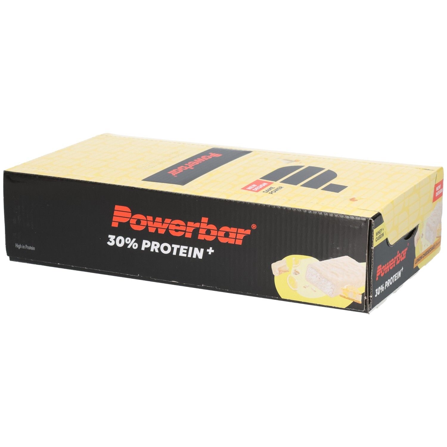 Gelbe Powerbar-Verpackung mit schwarzem Logo und Schriftzug. Enthält 30% Protein+. Aufdruck: Lemon Cheesecake. Neue Design-Kennzeichnung.