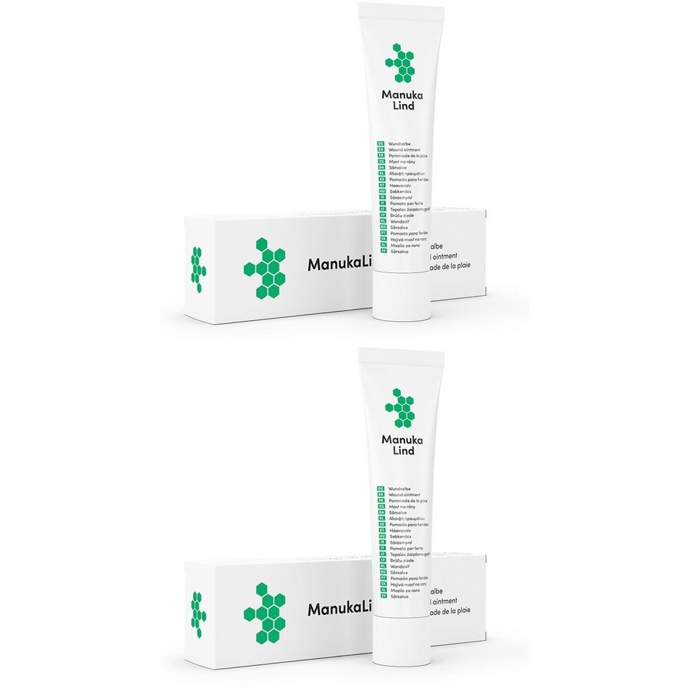 Zwei Tuben und Schachteln. Auf den Tuben und Schachteln ist das Logo und der Schriftzug "Manuka Lind" zu sehen.