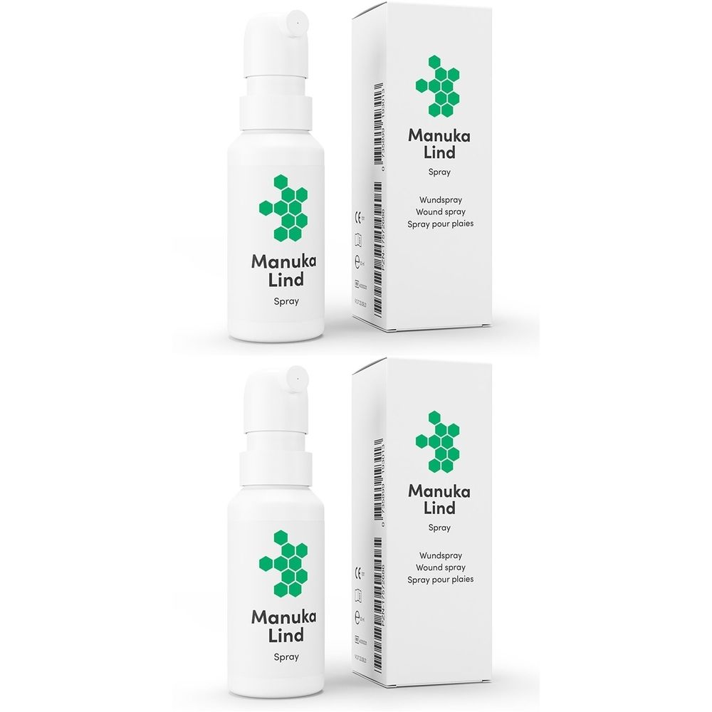 Weiße Sprühflasche und Karton mit grünem Logo. Aufschrift: Manuka Lind Spray, Wundspray, Spray pour plaies.