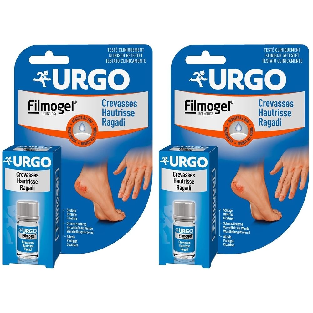 Zwei Packungen URGO Filmogel. Blaue Verpackung mit Produktnamen und Abbildung eines Fußes mit Riss. Fläschchen sichtbar.