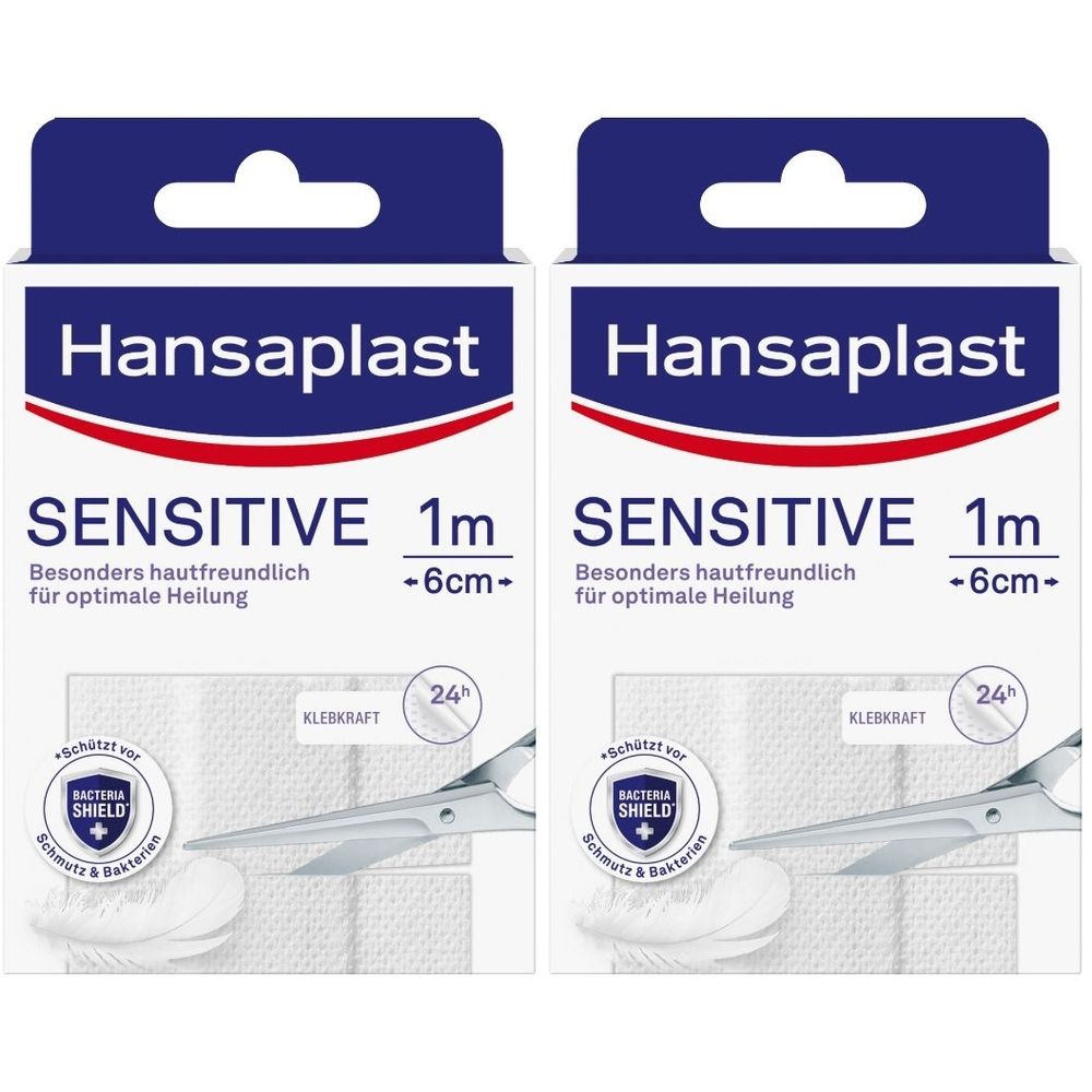 Zwei Packungen Hansaplast Sensitive Pflaster. Aufschrift: Sensitive, 1m, -6cm-. Mit Schere und Bacteria Shield Symbol.