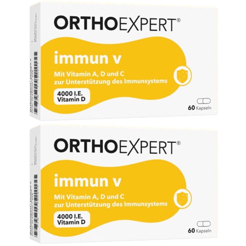 Zwei Packungen ORTHOexpert® immun v. Weiße Schachteln mit gelben Elementen. Aufschrift: immun v, 4000 I.E. Vitamin D, 60 Kapseln.