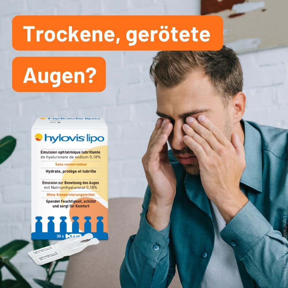 Mann reibt sich die Augen neben einer Packung HYLOVIS LIPO Augentropfen.