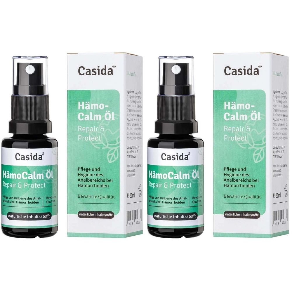 Drei Flaschen mit Sprühkopf und Verpackung. Aufschrift: HämoCalm Öl Repair & Protect. Marke: Casida.