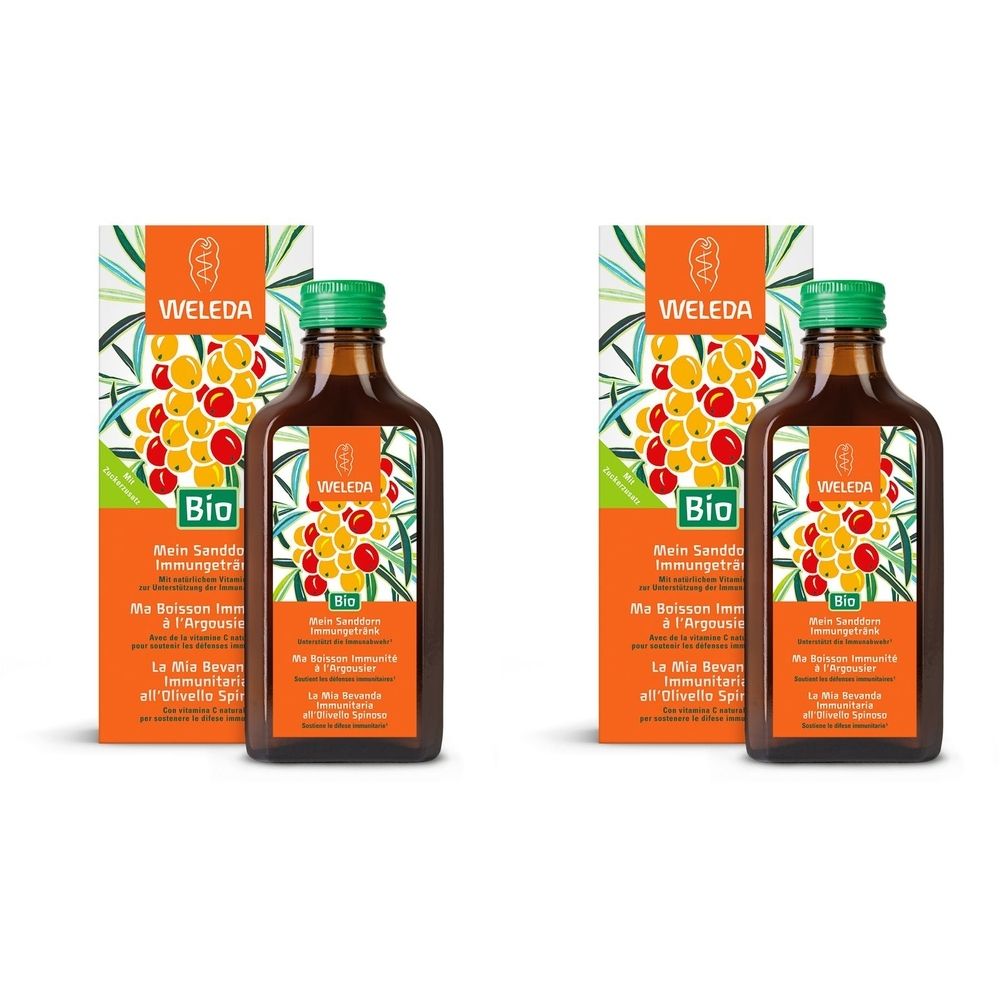 Zwei Flaschen mit braunem Glas und grünen Deckeln, daneben zwei Kartons. Auf den Etiketten steht "WELEDA" und "Bio".