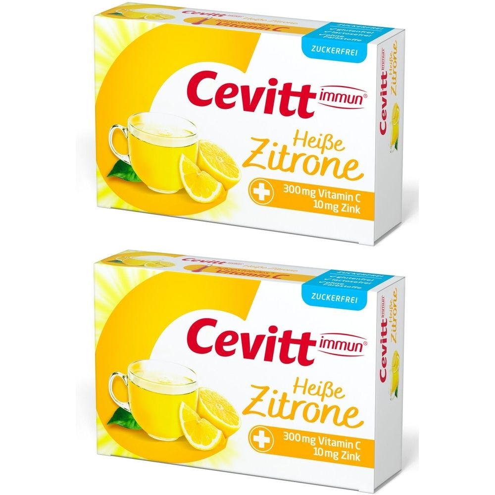 Zwei Kartons Cevitt immun Heiße Zitrone. Aufdruck: 300mg Vitamin C, 10mg Zink. Gelb-weißes Design mit Zitrone und Tasse.