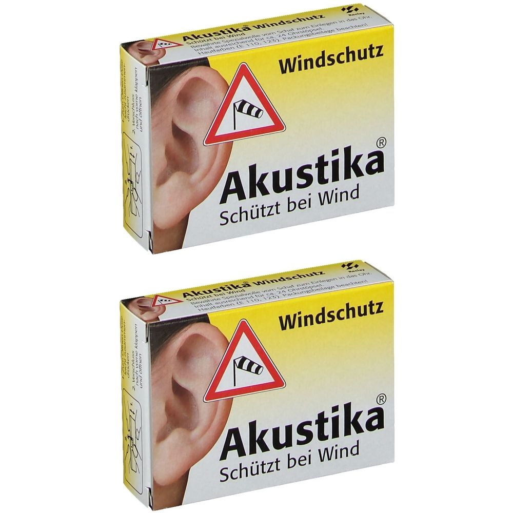 Zwei Schachteln Akustika Windschutz. Gelbe Verpackung mit Ohr-Illustration und Windwarnschild. Text: Akustika, Schützt bei Wind.