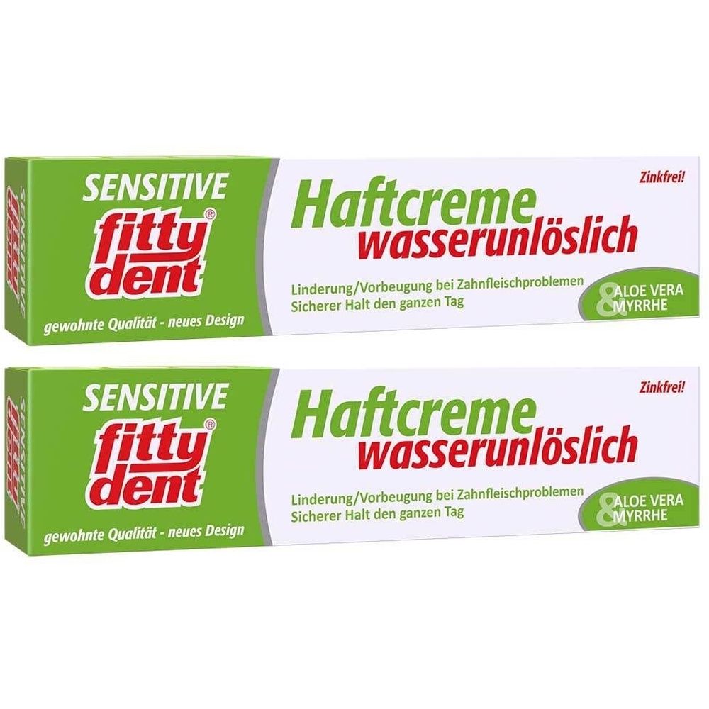 Zwei Tuben fittydent® sensitive Haftcreme. Grün-weiße Verpackung mit Produktnamen und Zusatzinformationen. Zinkfrei.