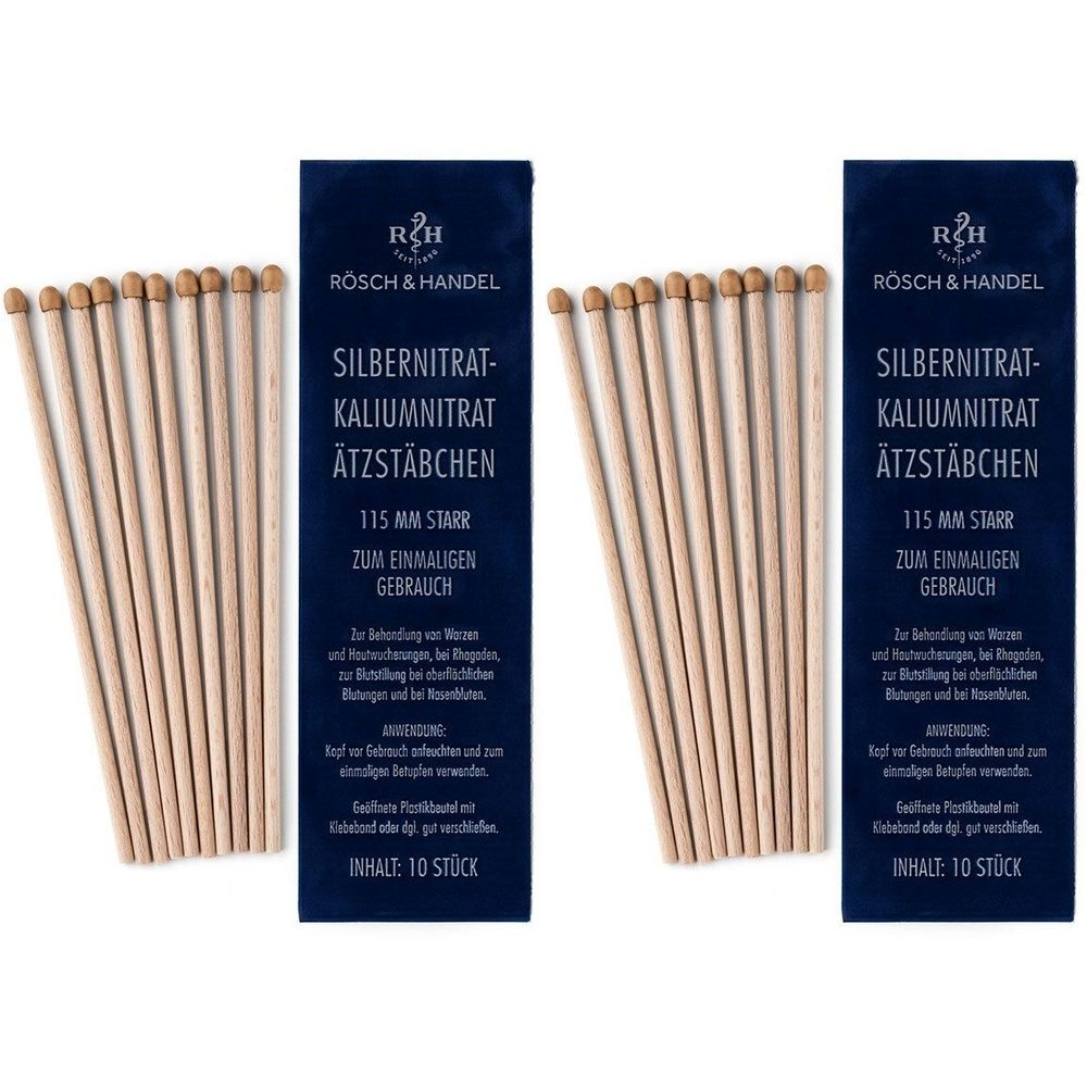 Zwei Packungen mit Silbernitrat-Kaliumnitrat-Ätzstäbchen. Jede Packung enthält 10 Stäbchen. Aufschrift: RÖSCH & HANDEL, 115 mm starr, zum einmaligen Gebrauch.