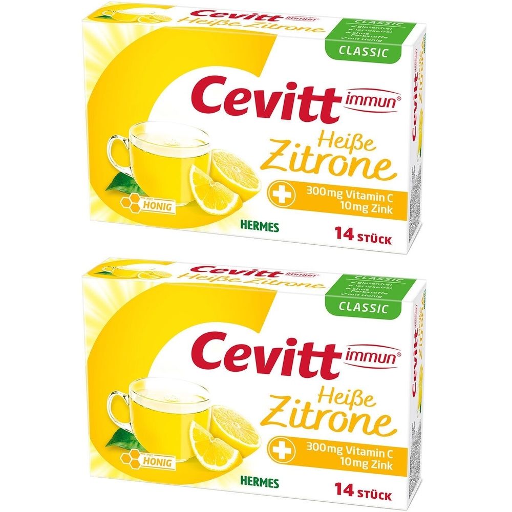 Zwei Packungen Cevitt immun Heiße Zitrone. Aufdruck: 300mg Vitamin C, 10mg Zink, 14 Stück. Abbildung: Zitrone, Honig, Tasse.