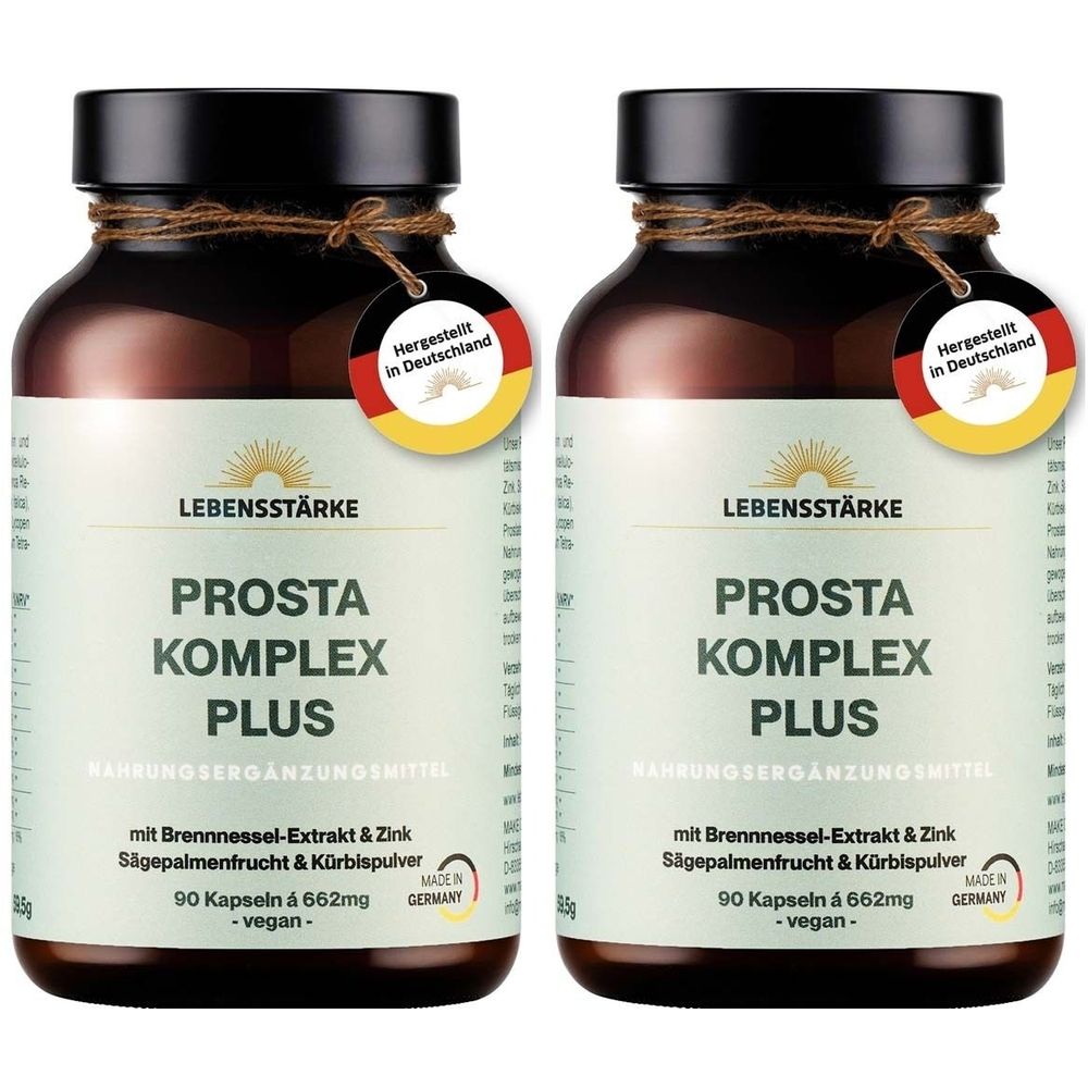 Zwei braune Glasflaschen mit schwarzen Deckeln. Aufschrift: Prosta Komplex Plus. Etikett mit Logo und Text. Anhänger: Hergestellt in Deutschland.