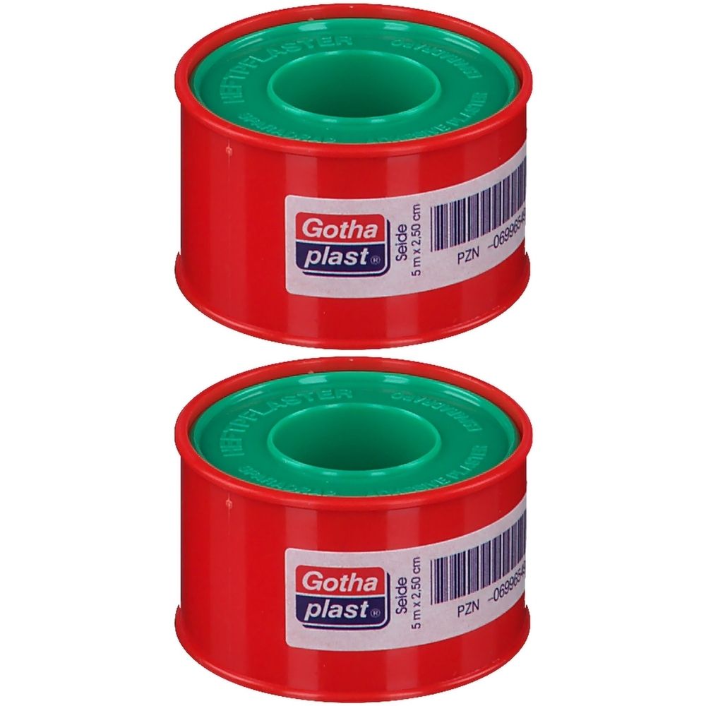 Zwei rote Rollen Gotha-plast Seiden-Heftpflaster. Grüne Innenrollen. Aufkleber mit Produktinformationen: 5 m x 2,50 cm.