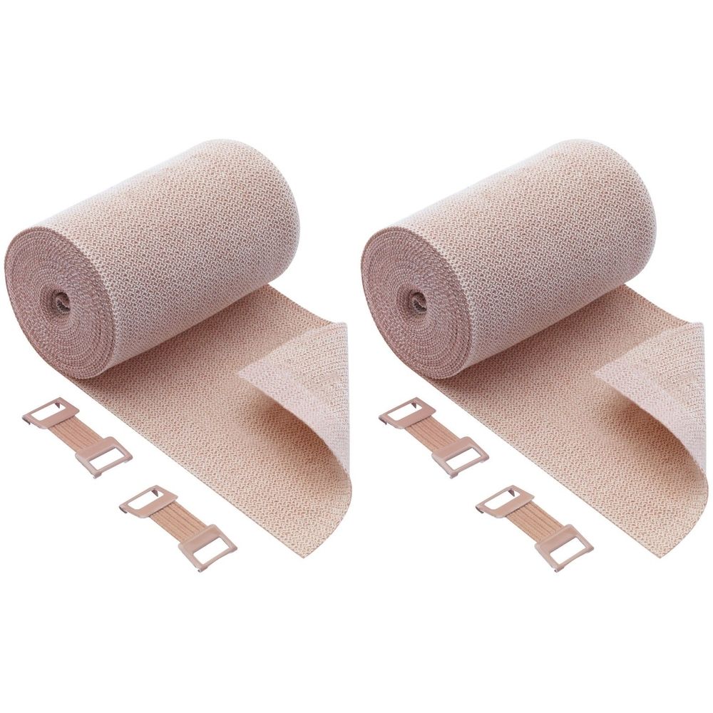 Zwei beige Kurzzugbinden mit Clips. Gerollte Form, Stoffstruktur sichtbar. Clips zur Befestigung.