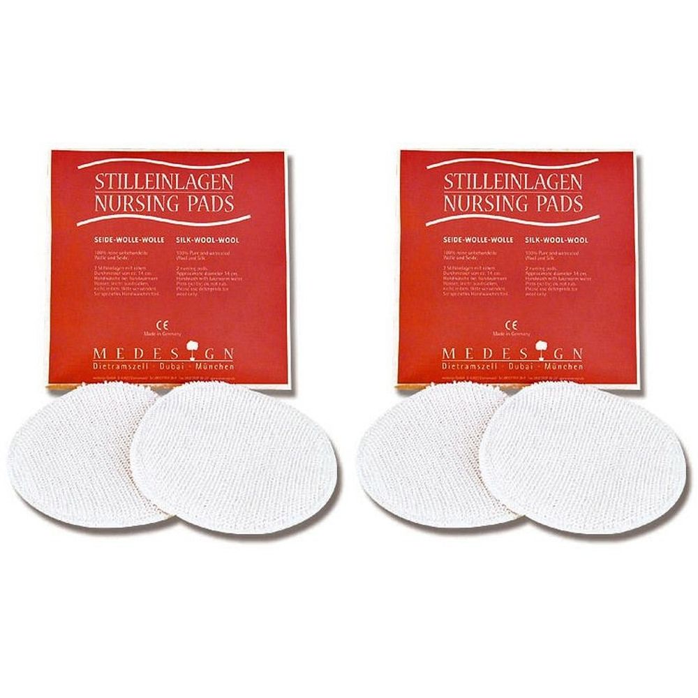 Zwei Packungen Stilleinlagen mit roter Verpackung. Darunter je drei runde, weiße Stilleinlagen. Aufdruck: Stilleinlagen, Nursing Pads.