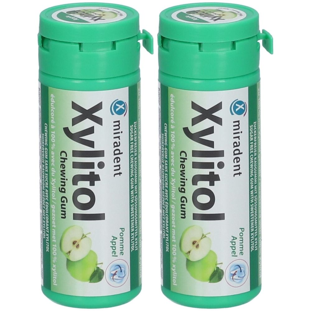 Zwei grüne Flaschen mit "Xylitol Chewing Gum"-Aufschrift. Apfel-Abbildung. Marke: miradent.