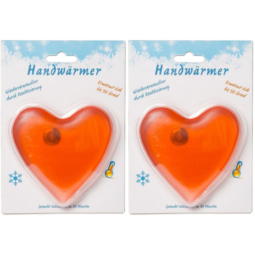 Zwei herzförmige Handwärmer in Verpackung. Orangefarbenes Gel in Kunststoffverpackung. Aufschrift: Handwärmer, bis 50 Grad.