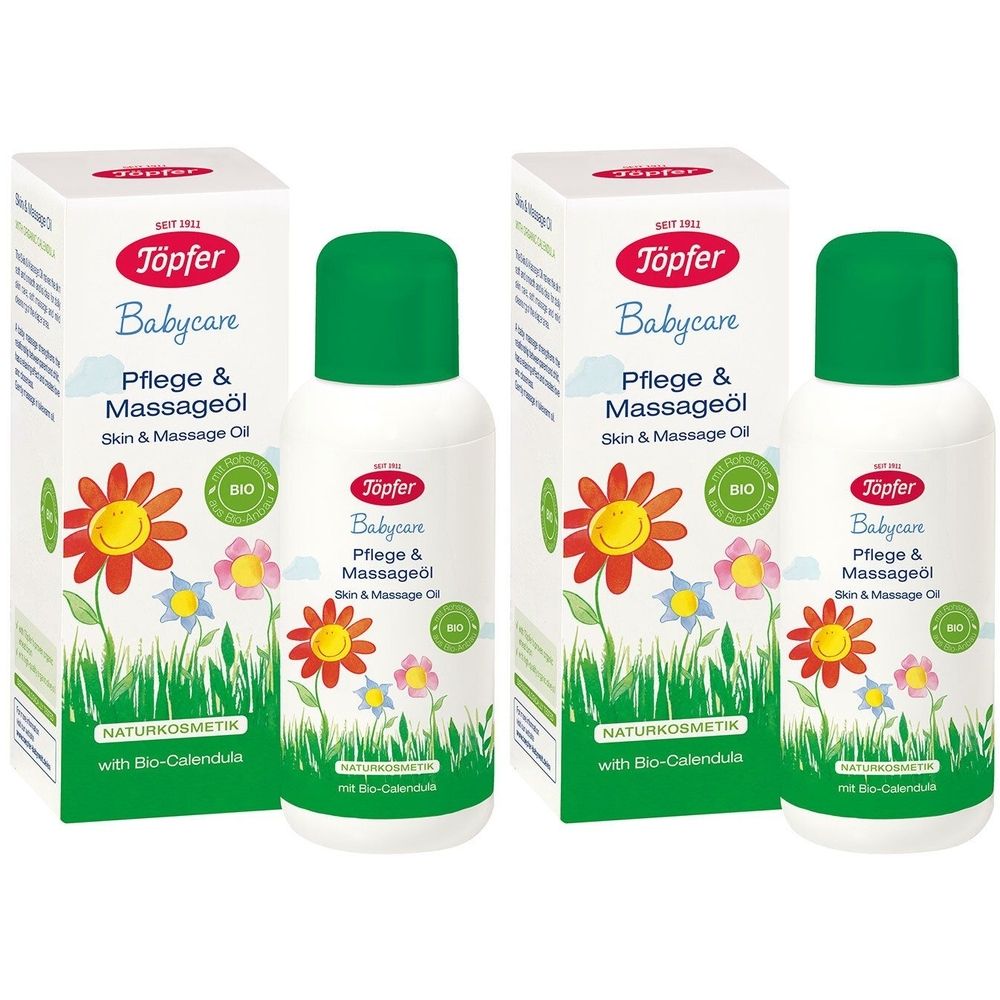 Zwei Flaschen und zwei Kartons. Aufschrift: Töpfer Babycare Pflege & Massageöl. Grün-weiße Verpackung mit Blumen.