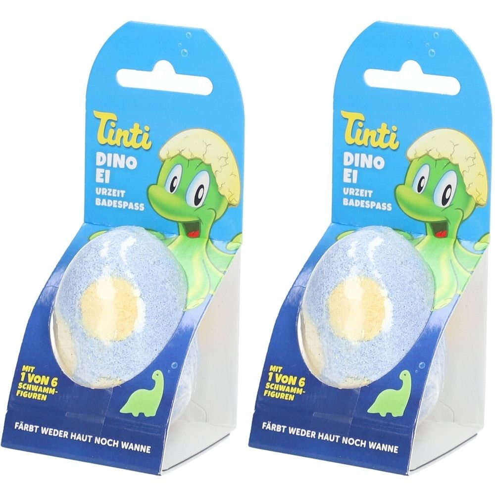 Zwei Packungen Tinti Dino Ei. Blaue Eiform mit gelbem Kern. Verpackung mit Dino-Illustration. Text: Urzeit Badespaß.