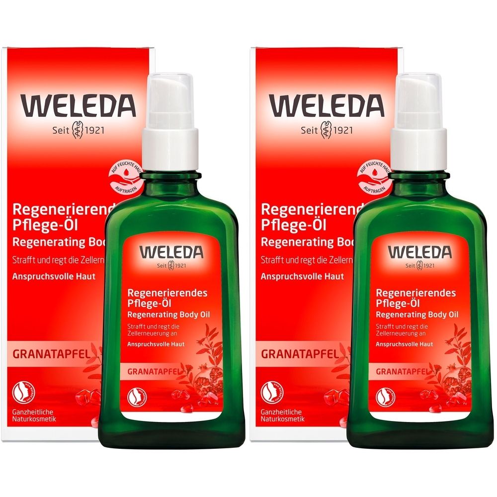 Zwei grüne Flaschen mit Sprühkopf und roter Verpackung. Aufschrift: WELEDA, Regenerierendes Pflege-Öl, Granatapfel.