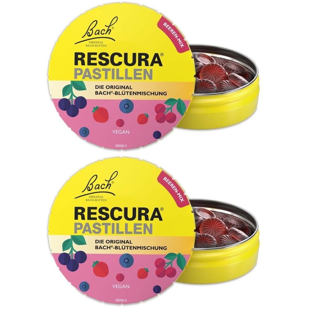 Zwei gelbe Dosen mit Pastillen. Auf dem Deckel steht "RESCURA PASTILLEN" und "Bach". Die Dosen sind mit Beeren-Mix beschriftet.